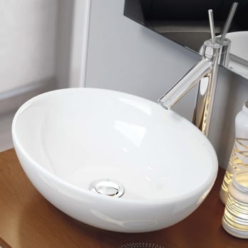 Lavabo sobre encimera ovalado para baño de diseño en cerámica Made in Italy  - Omarance